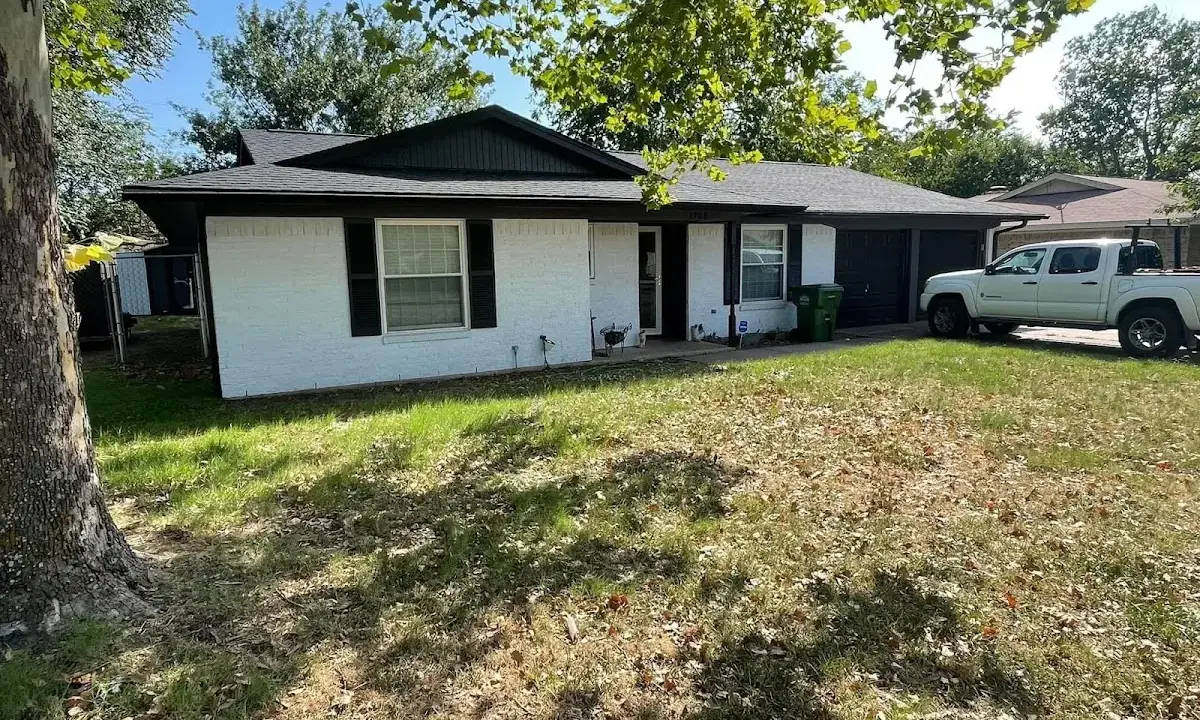 Professional roofing crew working on a residential roof in St. Joseph